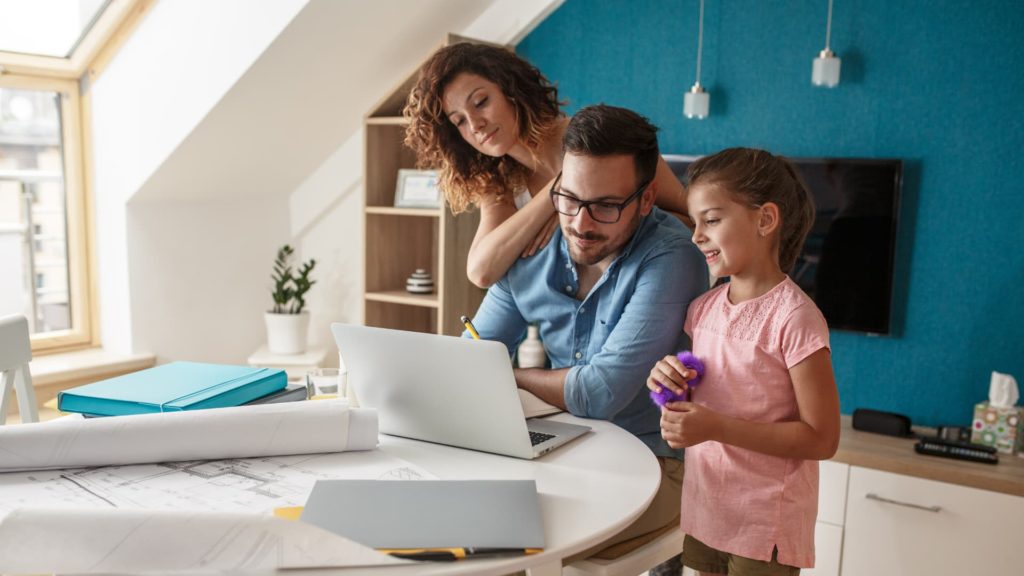a family using a laptop