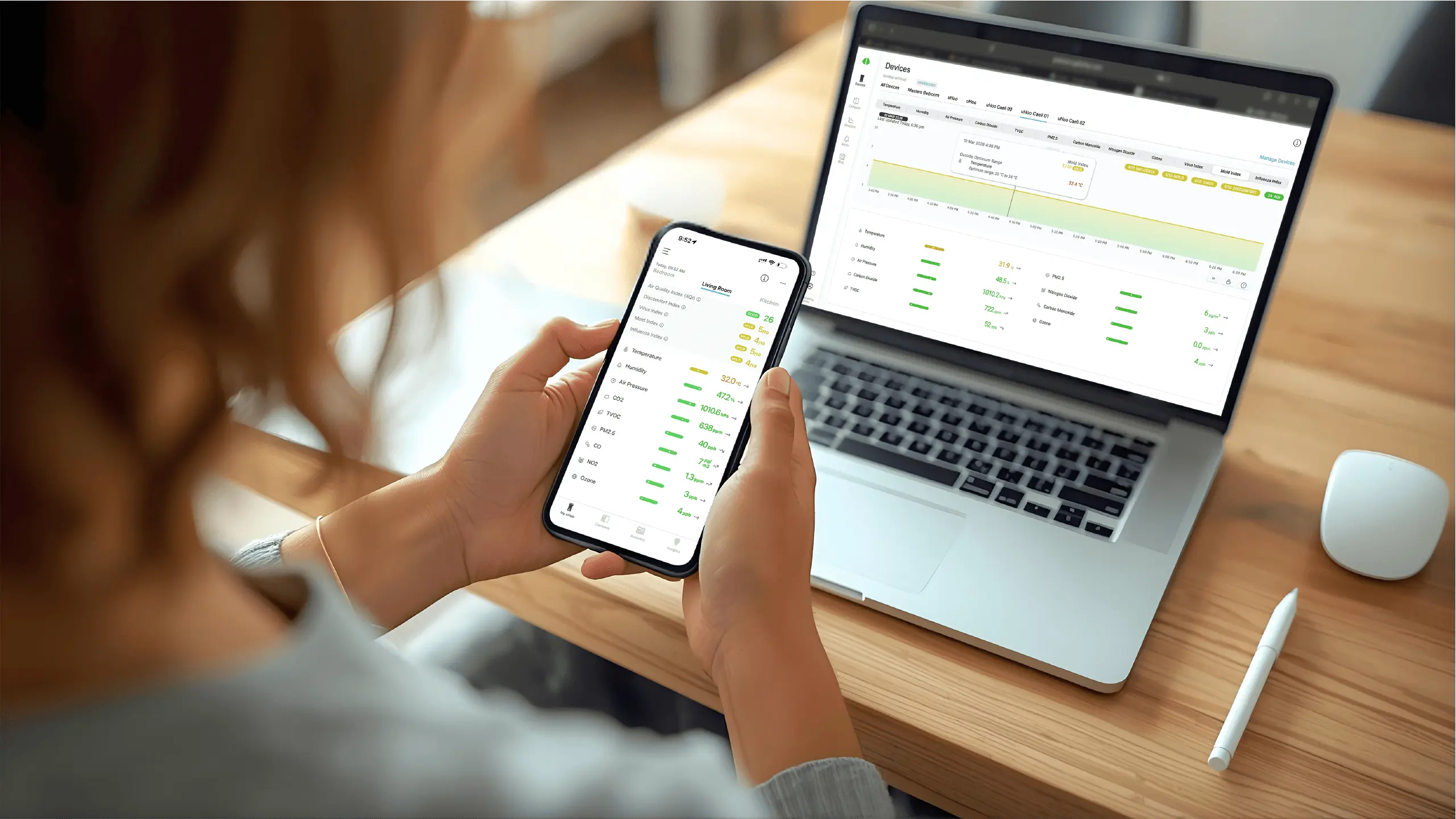Person reviewing health data on a tablet in a bright modern home